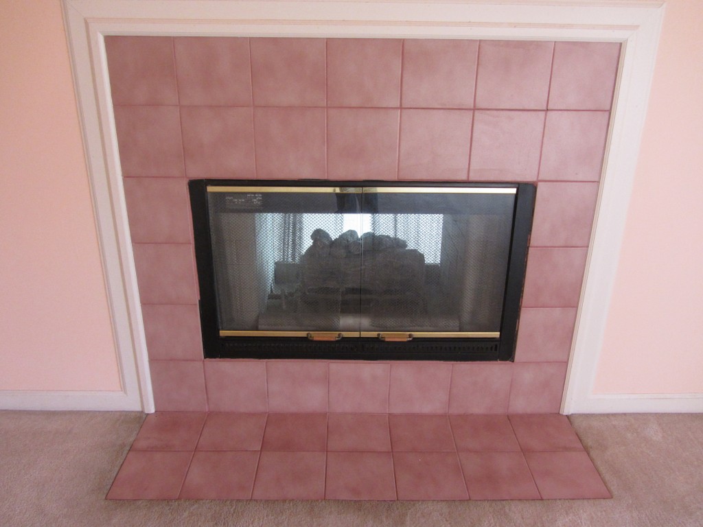 Pink ceramic tile fireplace surround