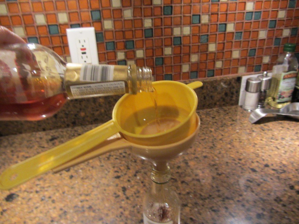 Homemade vanilla extract being strained