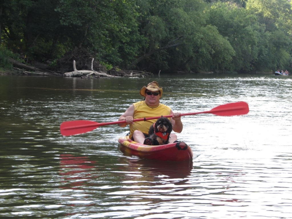 Man and dog in a kayak