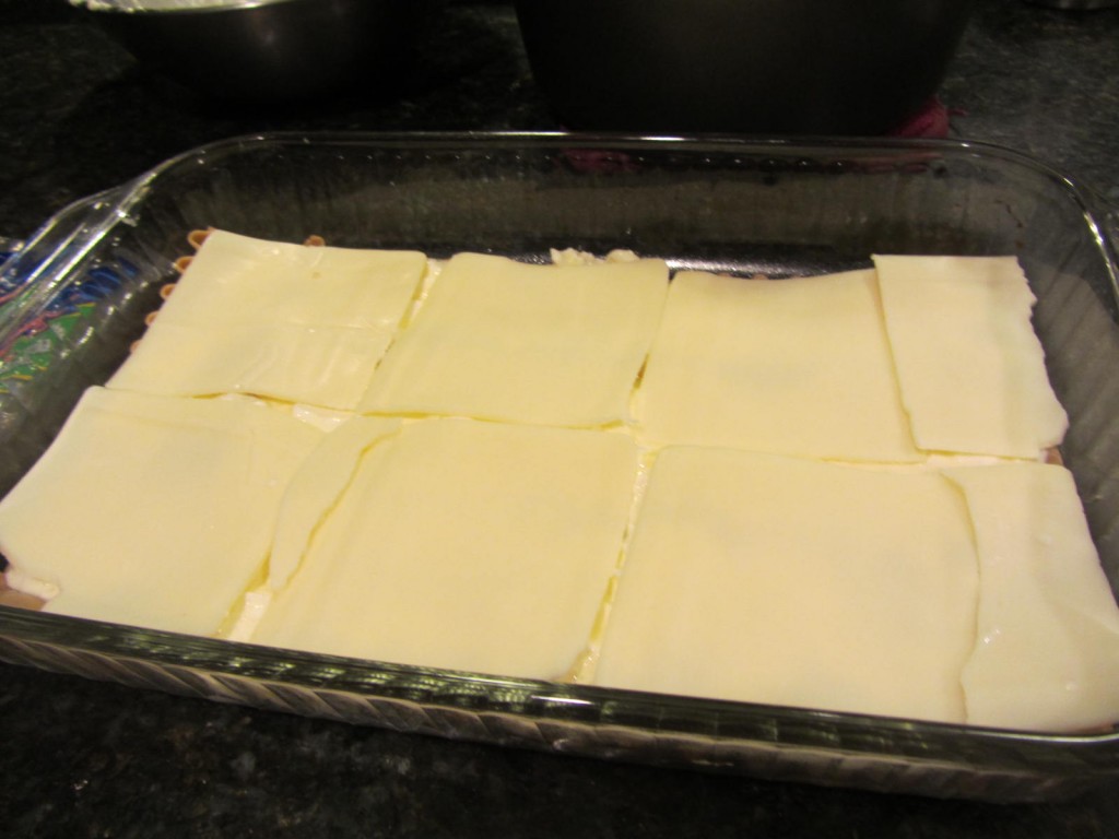 Lasagna covered in mozzarella cheese
