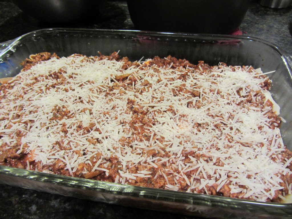 Lasagna covered in parmesan cheese